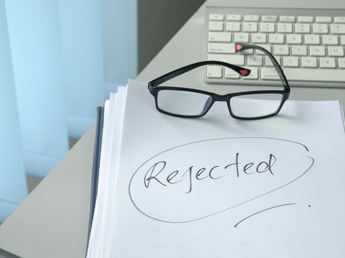 'Rejected' hand written on A4 paper