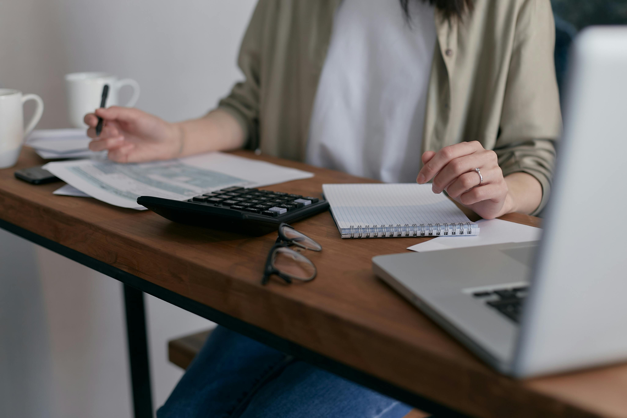 woman at desk going through figures
