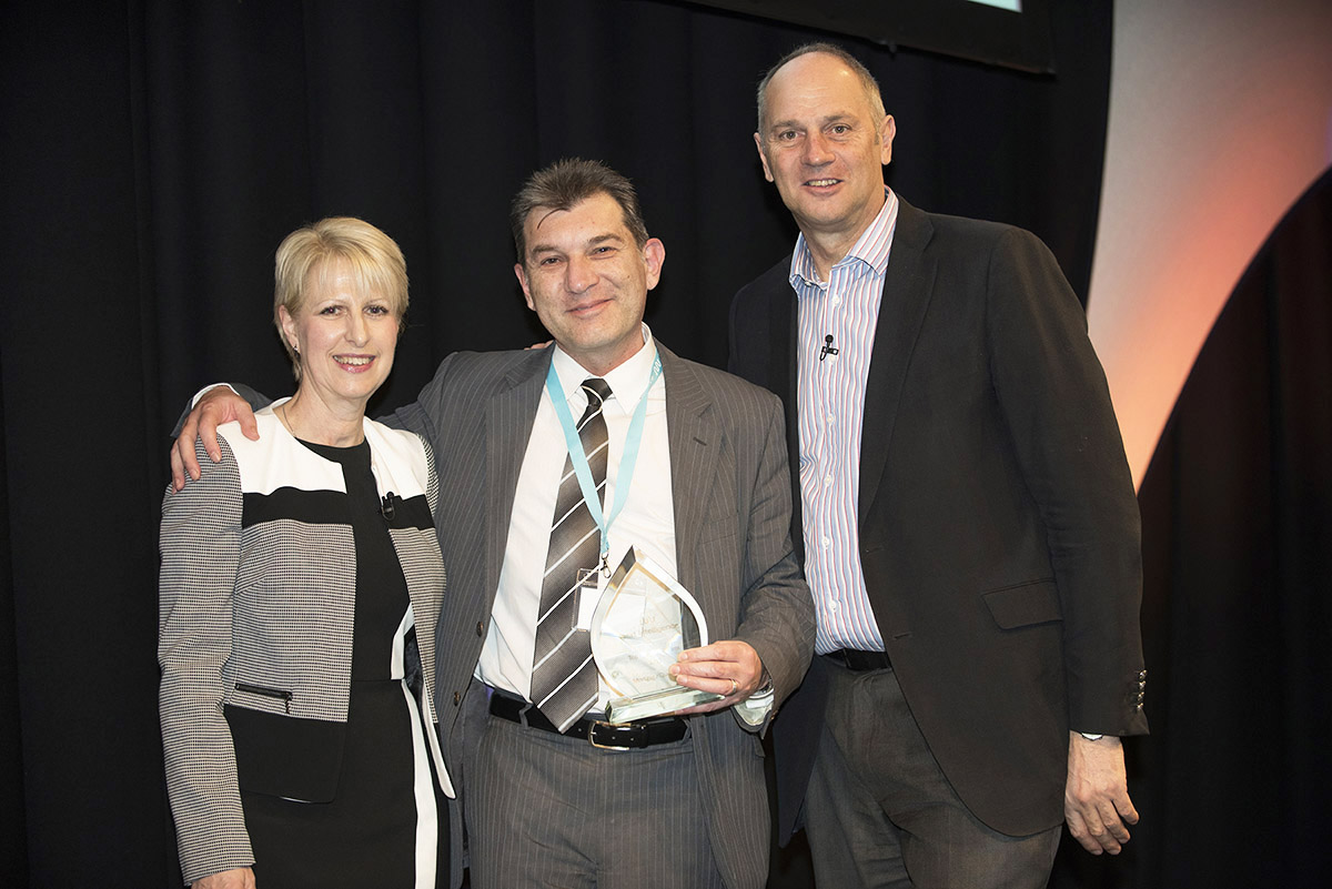 MD John Yerou accepting award from Sir Steve Redgrave