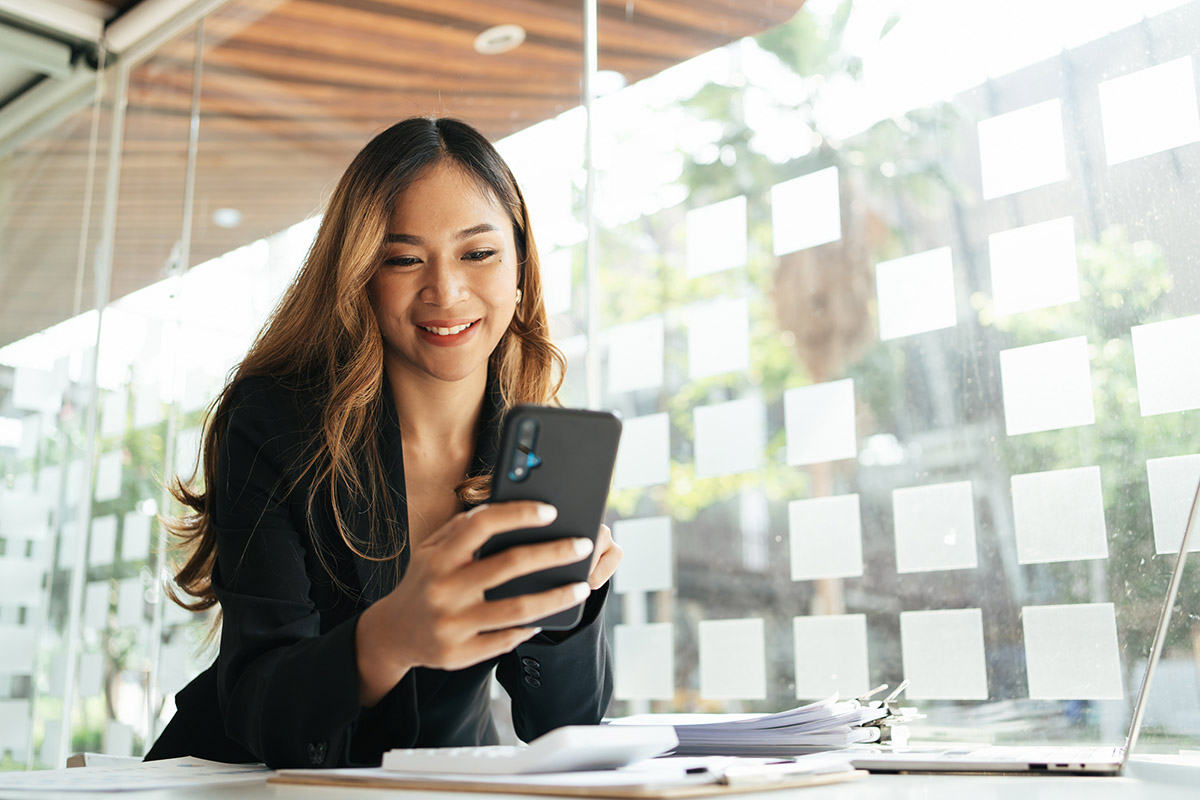 Businesswoman in formal suit in office happy and cheerful